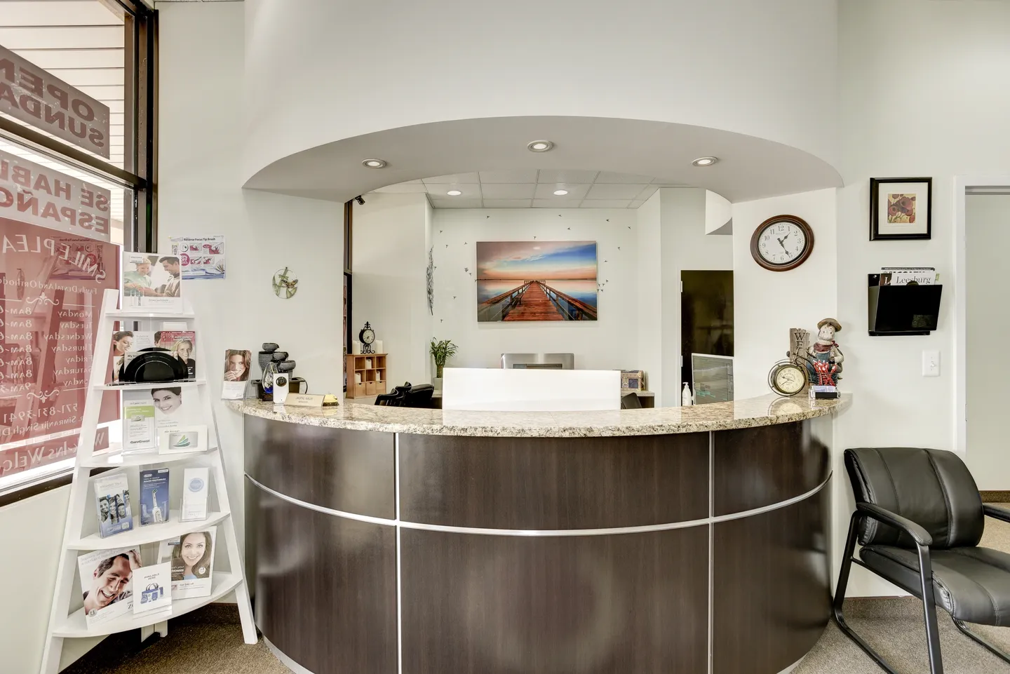 Modern reception desk area in a clean, bright office space.