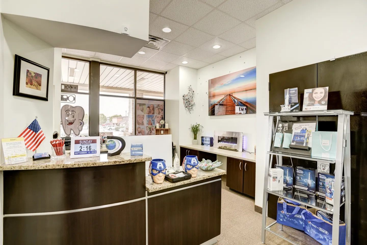Modern pharmacy interior with product displays and a service counter.